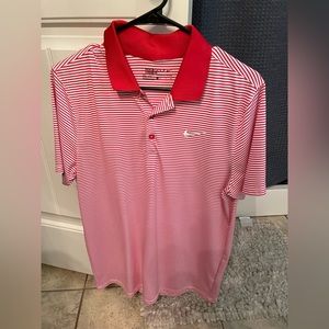 Men’s Nike golf polo. Red and white stripes. Size small. EUC.